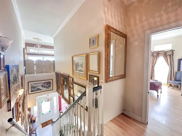 a view of an entryway with wooden floor
