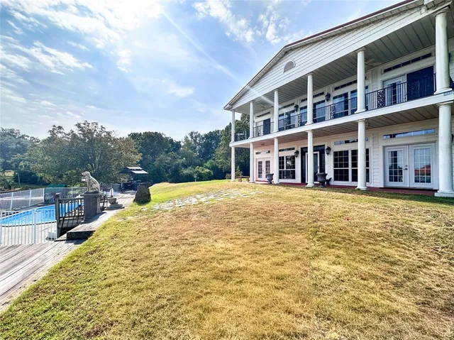 a swimming pool with buildings in the background