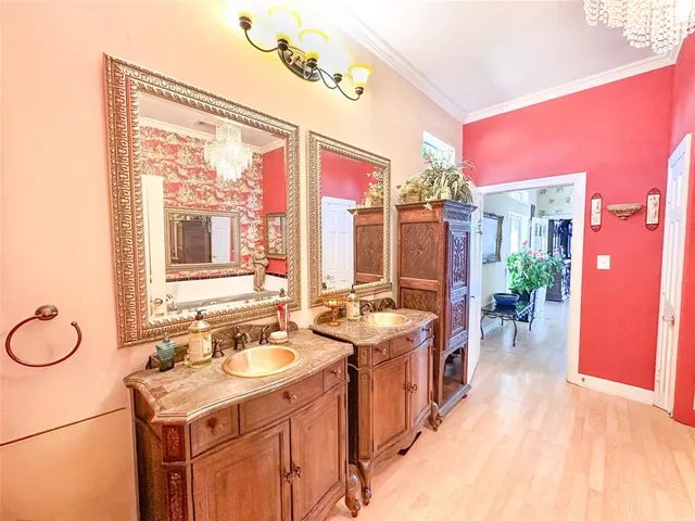 a bathroom with a sink a mirror and a shower