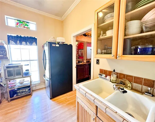 a kitchen with stainless steel appliances a refrigerator and a sink