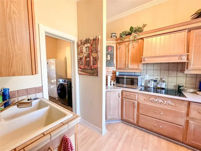 a kitchen with a sink stove and refrigerator