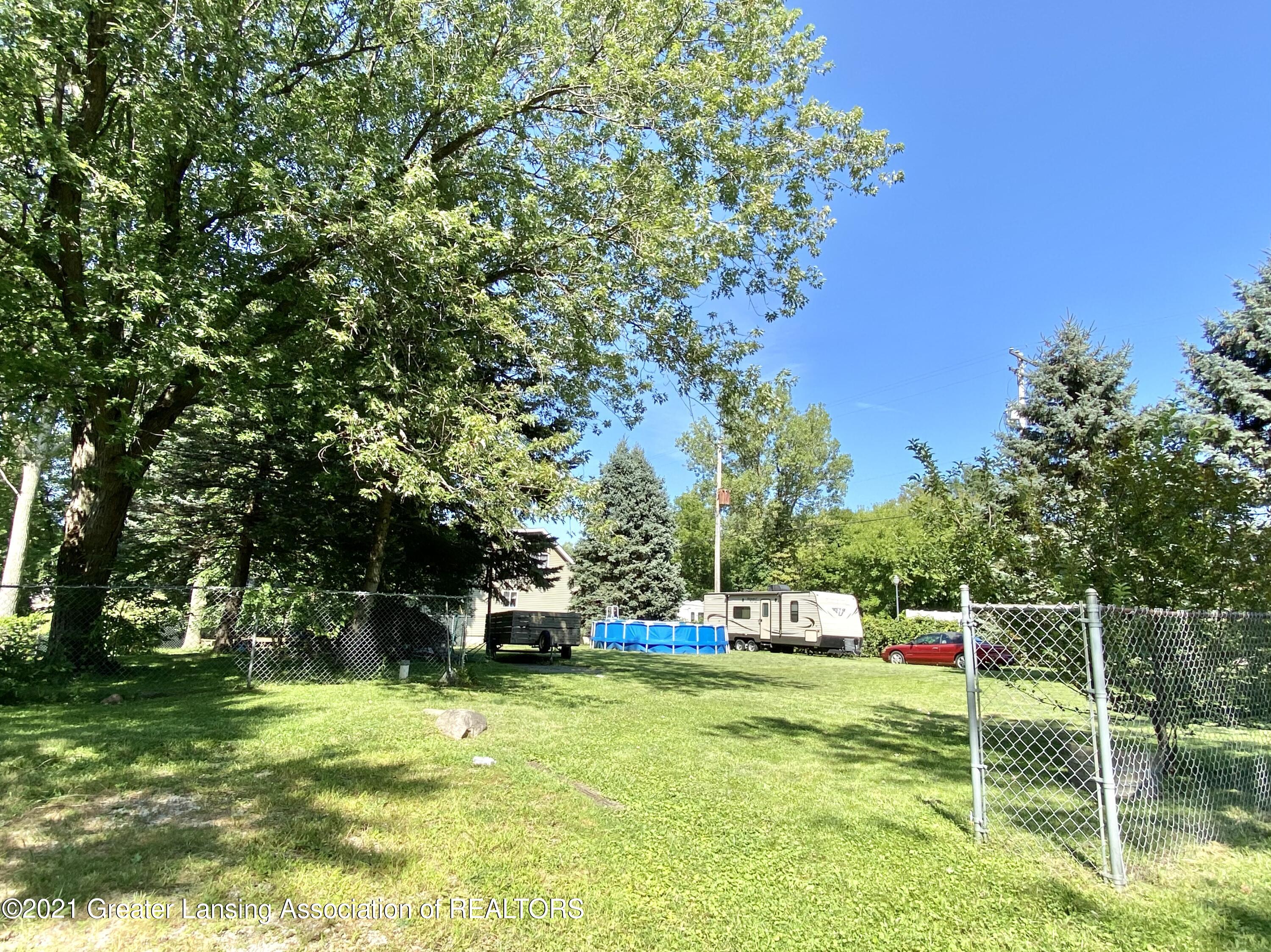 16074 Brook Road Lansing, MI 48906 - Photo 33 of 40 Half acres that is mostly fenced
