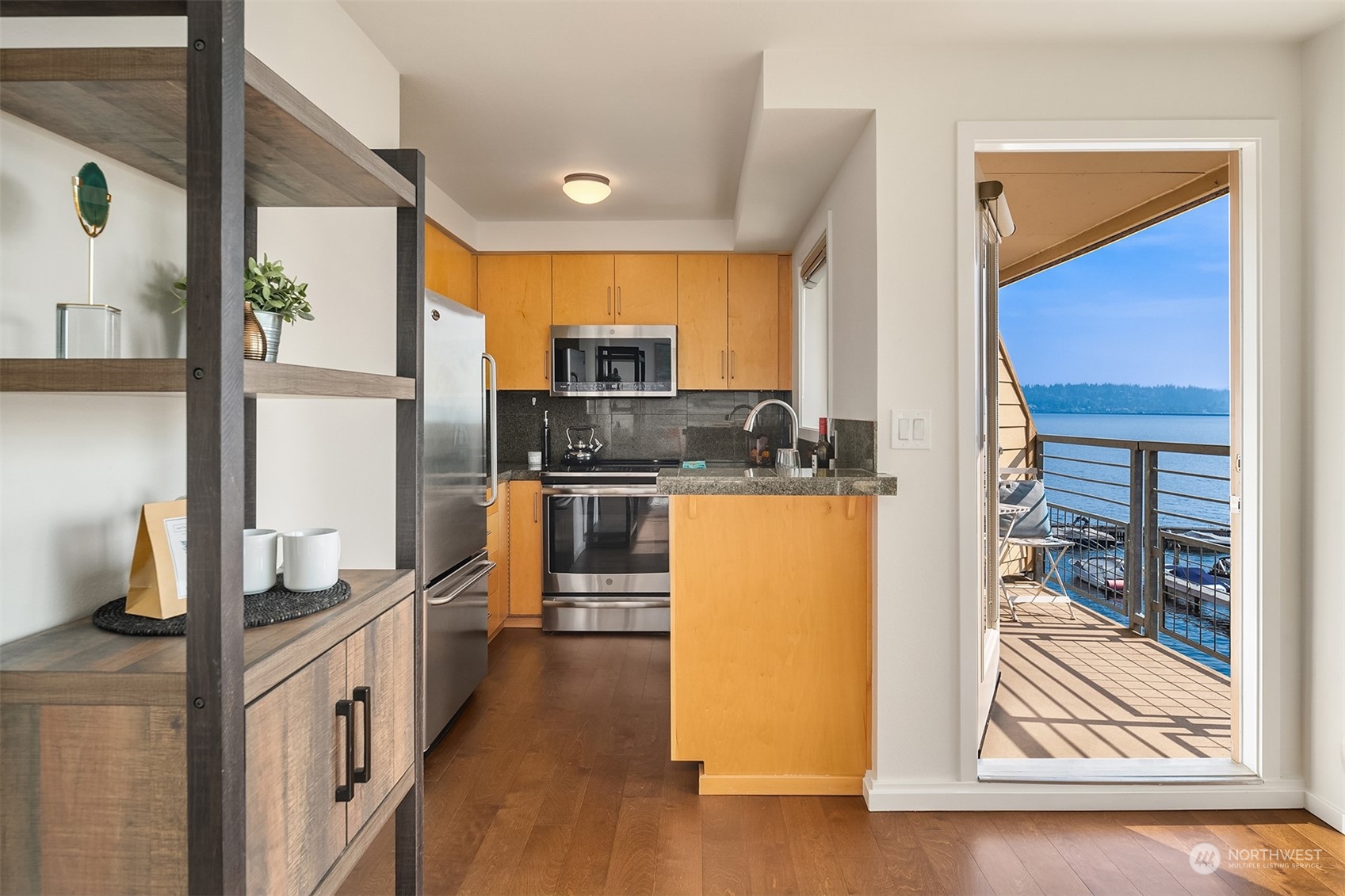 334 Lakeside Avenue South, Unit 401 Seattle, WA 98144 - Photo 9 of 24 a kitchen with stainless steel appliances granite countertop a refrigerator and a stove