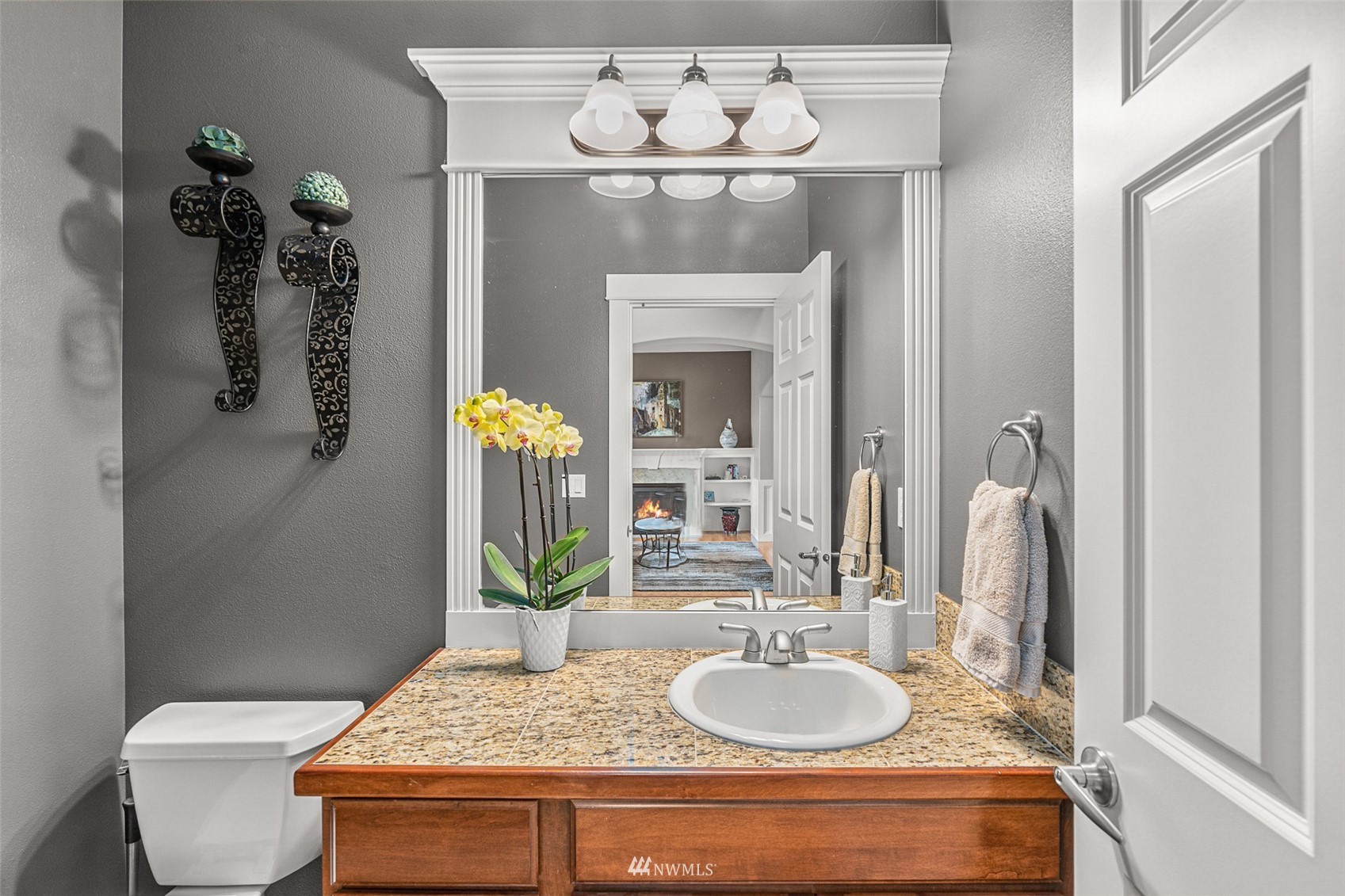22404 5th Place West Bothell, WA 98021 - Photo 13 of 40 a bathroom with a granite countertop sink a toilet and a mirror
