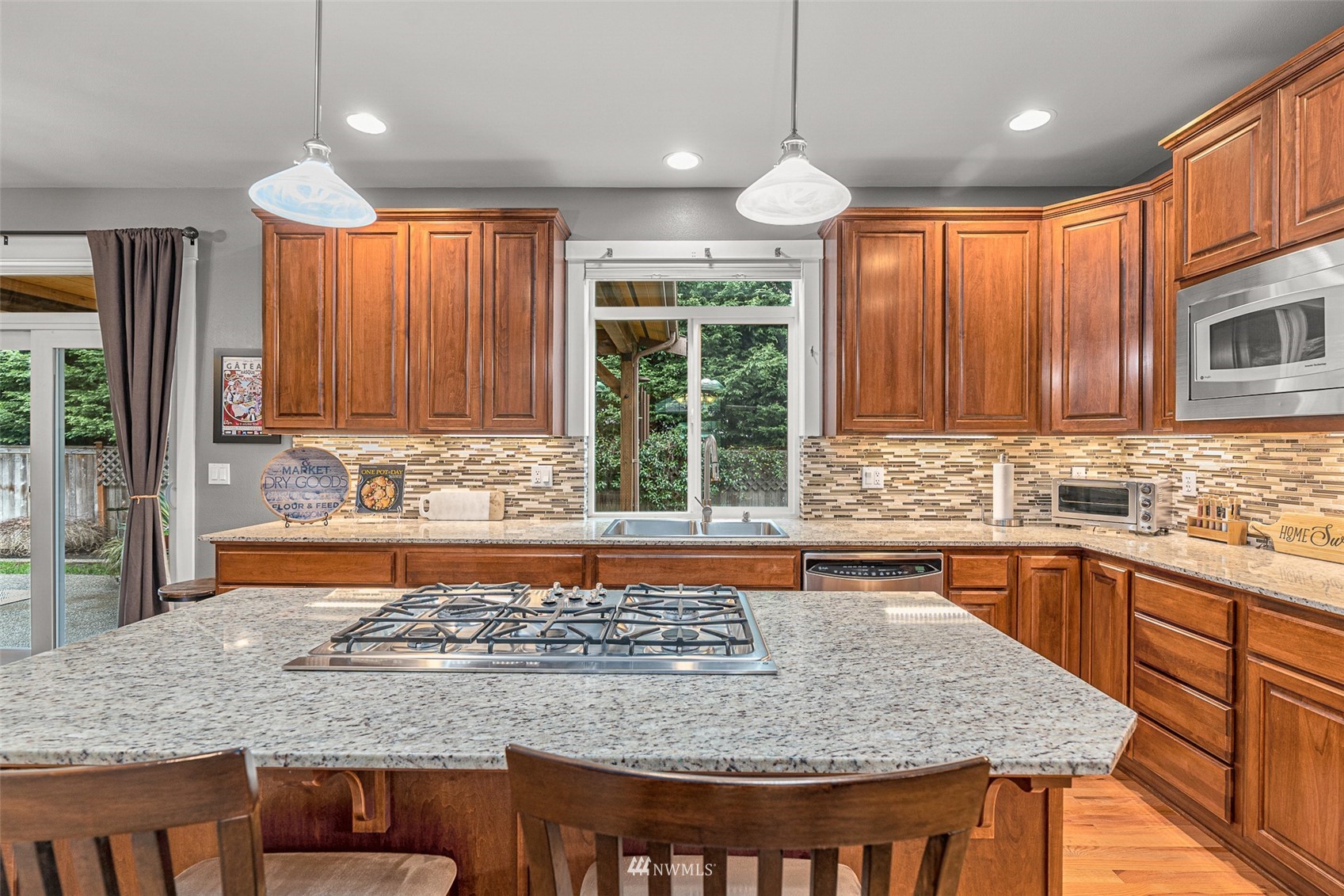 22404 5th Place West Bothell, WA 98021 - Photo 18 of 40 a kitchen with large window a sink and cabinets