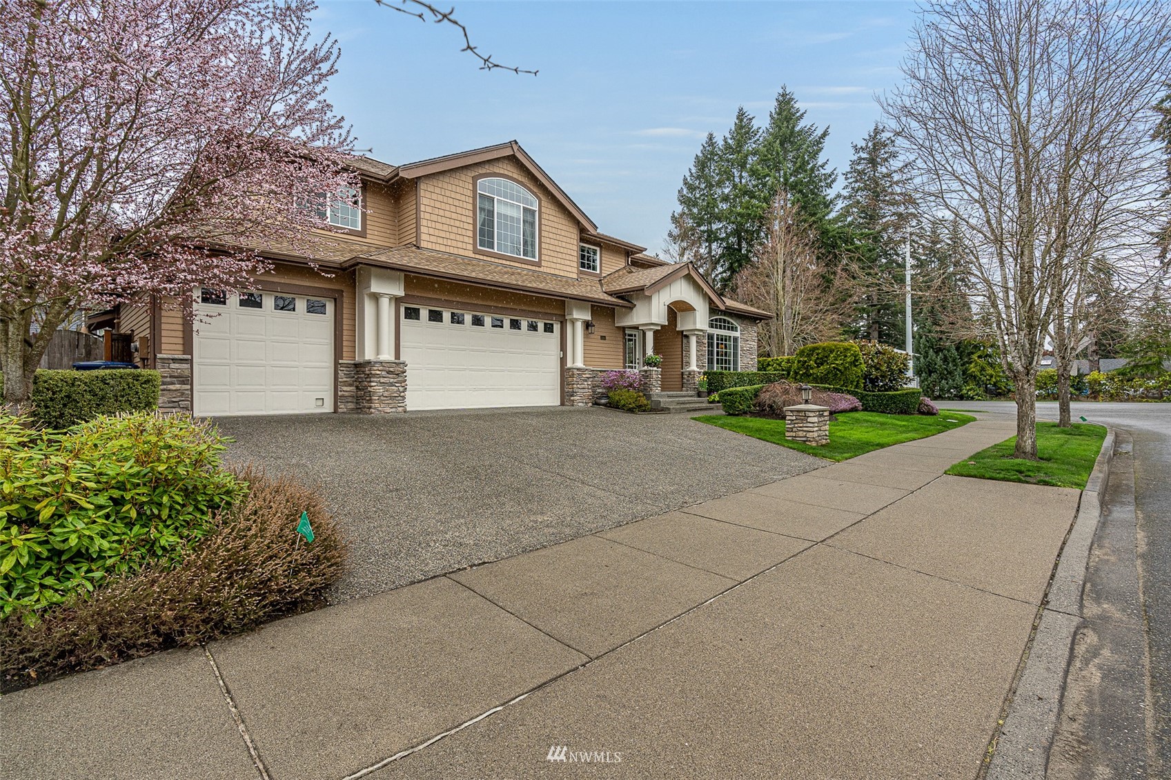 22404 5th Place West Bothell, WA 98021 - Photo 2 of 40 a front view of a house with a yard and garage