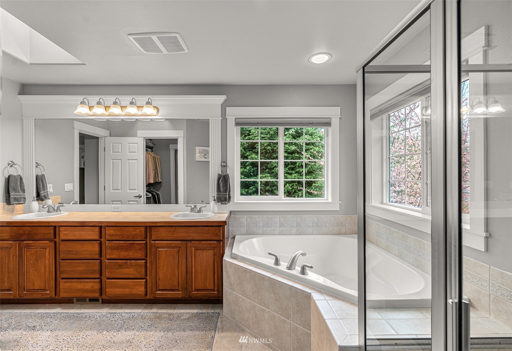 22404 5th Place West Bothell, WA 98021 - Photo 31 of 40 a spacious bathroom with a tub sink and mirror