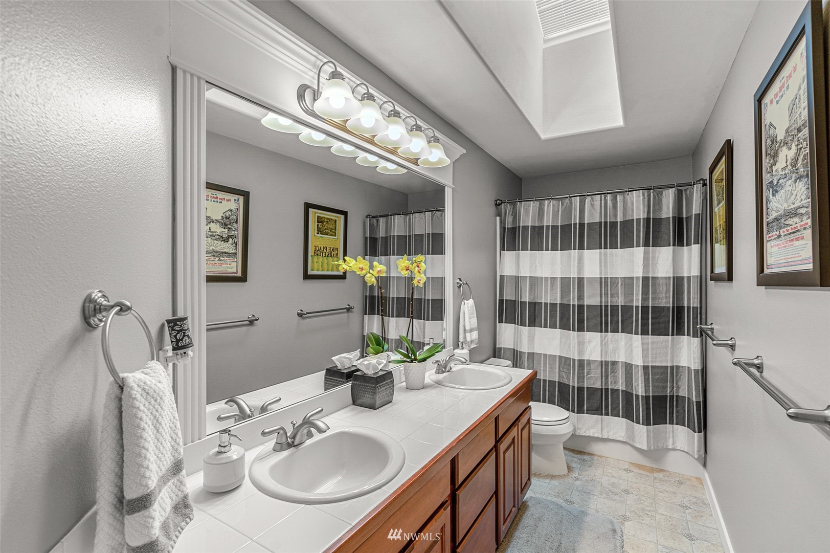 22404 5th Place West Bothell, WA 98021 - Photo 35 of 40 a bathroom with a sink a tub shower and mirror