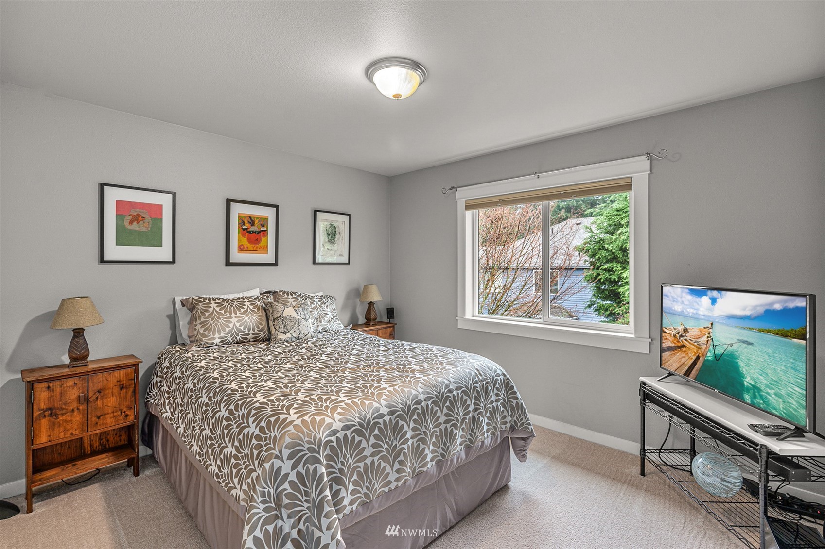 22404 5th Place West Bothell, WA 98021 - Photo 37 of 40 a bedroom with a bed and a flat screen tv