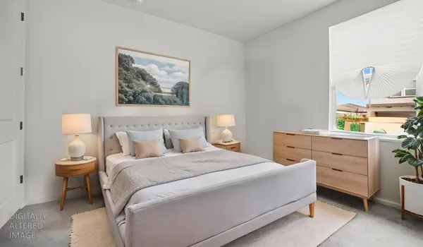 a bedroom with a bed and a dresser