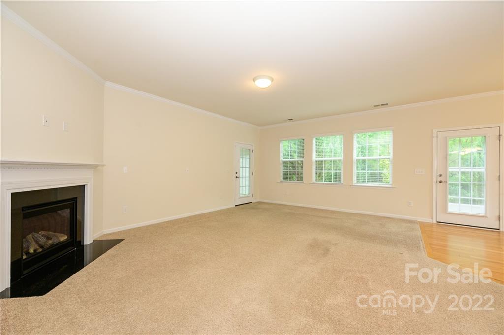 4241 Perth Road Indian Land, SC 29707 - Photo 15 of 34 an empty room with windows and fireplace