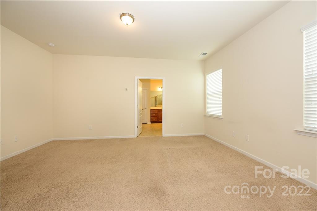 4241 Perth Road Indian Land, SC 29707 - Photo 19 of 34 an empty room with windows and cabinet