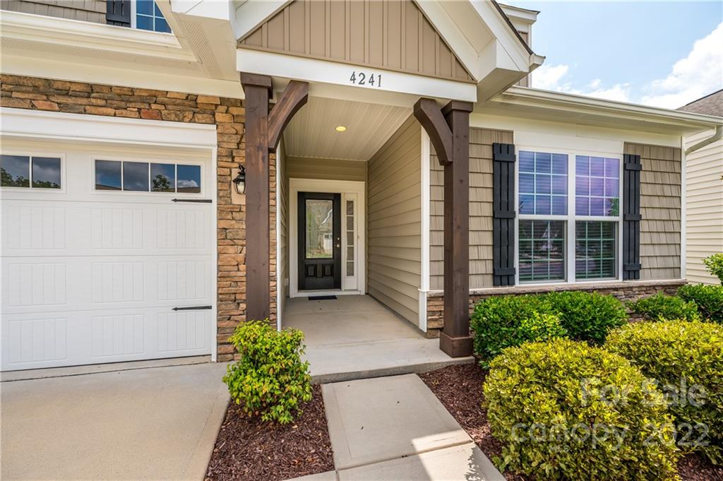 4241 Perth Road Indian Land, SC 29707 - Photo 2 of 34 a front view of a house with a lots of flowers