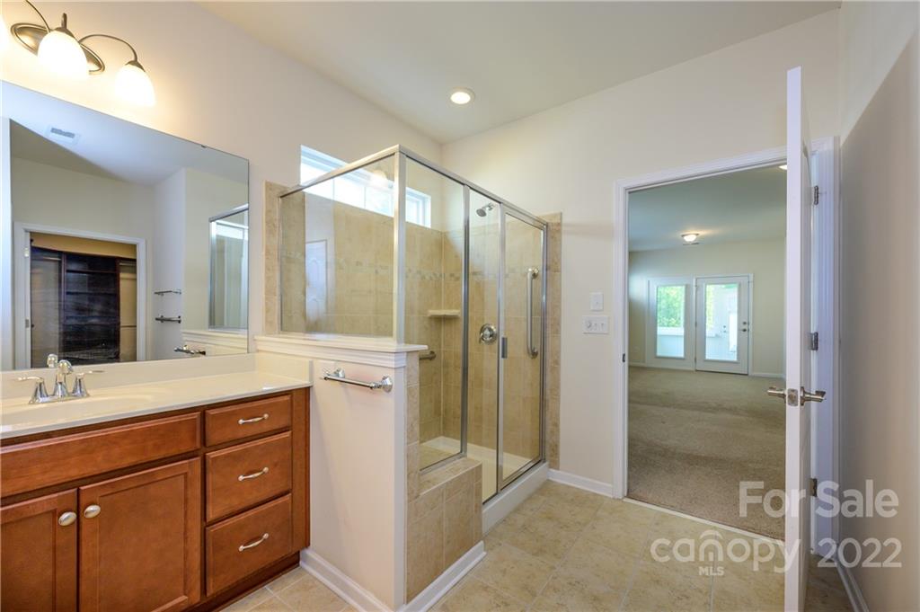4241 Perth Road Indian Land, SC 29707 - Photo 21 of 34 a bathroom with a granite countertop sink mirror and double