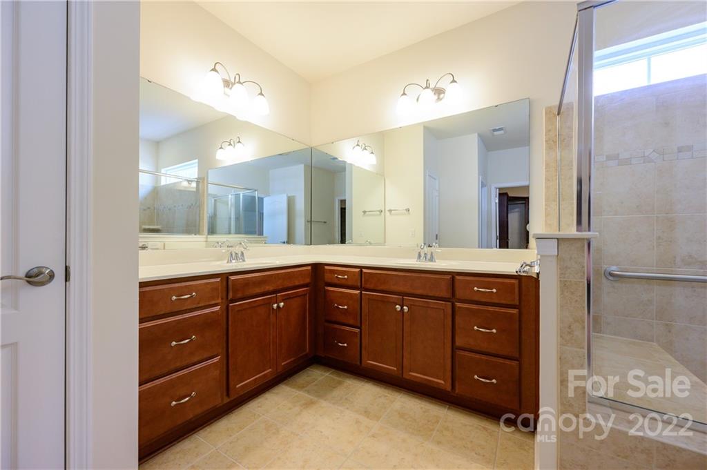 4241 Perth Road Indian Land, SC 29707 - Photo 22 of 34 a spacious bathroom with a sink vanity and mirror