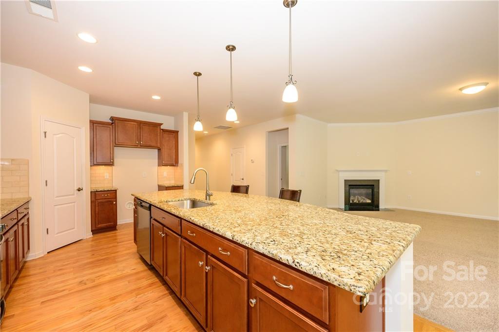4241 Perth Road Indian Land, SC 29707 - Photo 7 of 34 a large kitchen with kitchen island a sink stainless steel appliances and a counter top