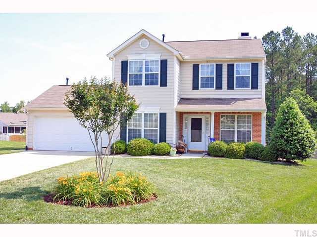 125 Ridge Lake Drive Apex, NC 27539 - Photo 1 of 12 a front view of a house with garden