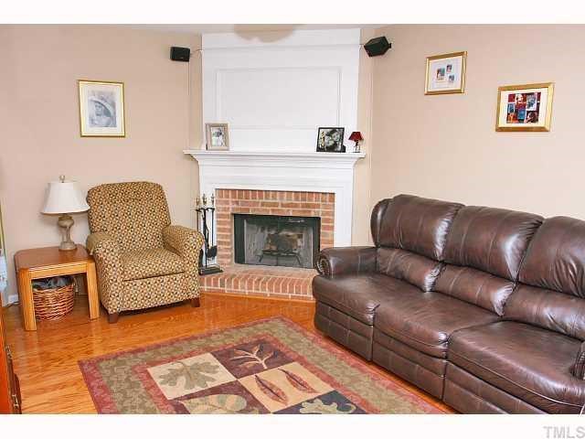 125 Ridge Lake Drive Apex, NC 27539 - Photo 2 of 12 a living room with furniture and a fireplace