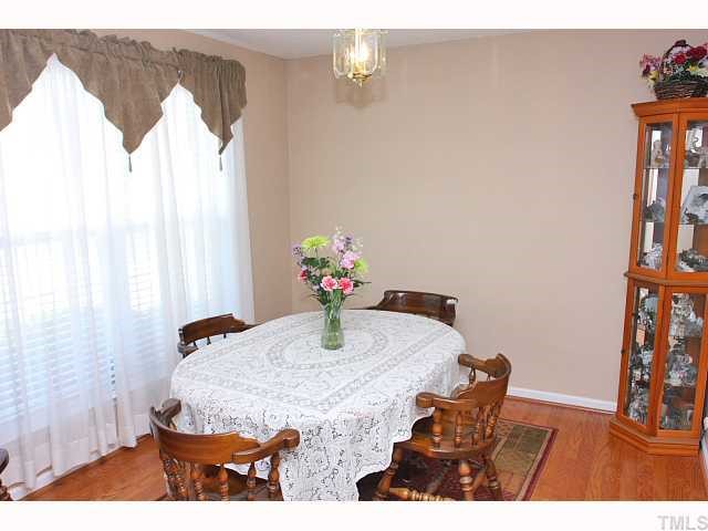 125 Ridge Lake Drive Apex, NC 27539 - Photo 3 of 12 a dining room with furniture and window