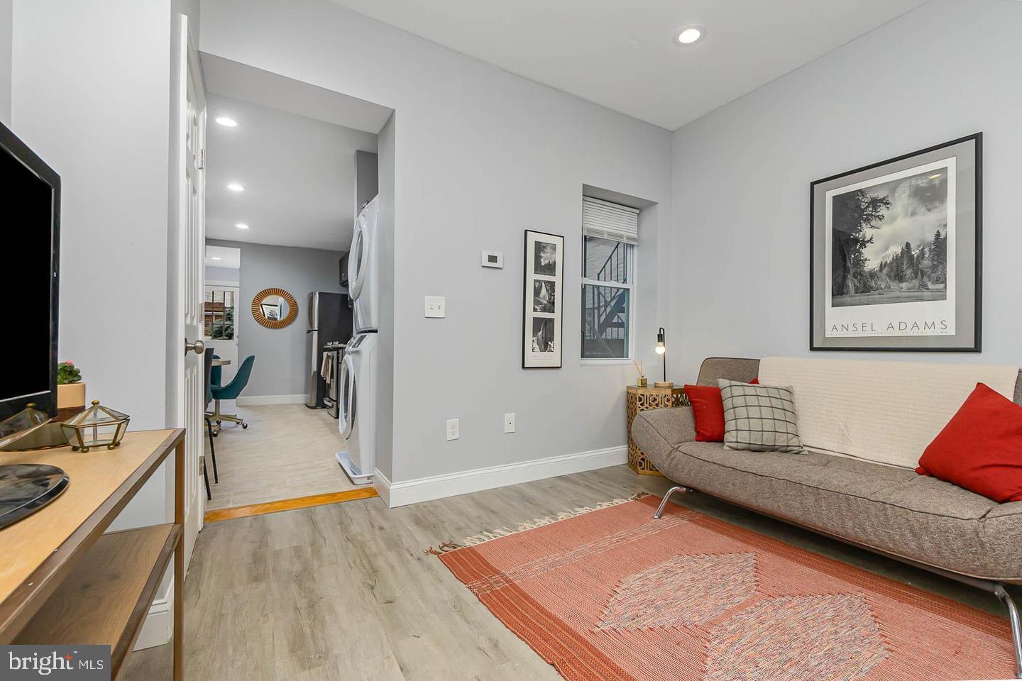 1709 Bank Street Baltimore, MD 21231 - Photo 11 of 49 a living room with furniture and a flat screen tv