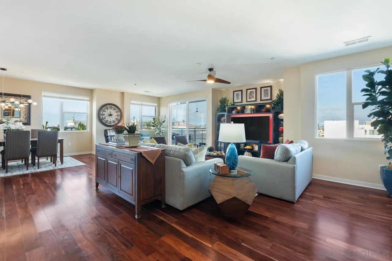 3650 Fifth Avenue, Unit 614 San Diego, CA 92103 - Photo 21 of 62 a living room with fireplace furniture and a wooden floor