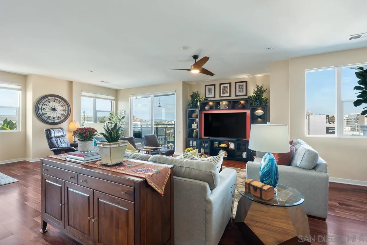3650 Fifth Avenue, Unit 614 San Diego, CA 92103 - Photo 22 of 62 a living room with furniture a window and a flat screen tv