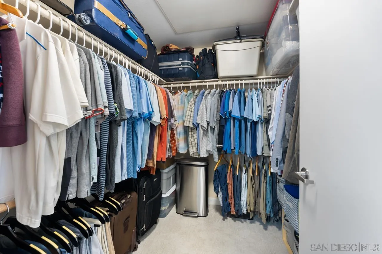 3650 Fifth Avenue, Unit 614 San Diego, CA 92103 - Photo 43 of 62 a view of walk in closet with clothes and shoes