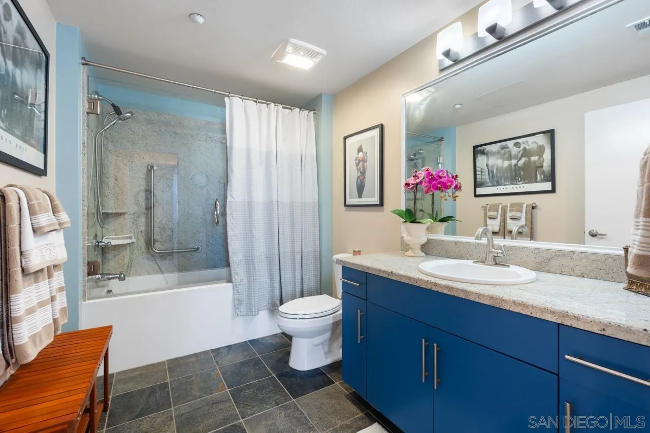 3650 Fifth Avenue, Unit 614 San Diego, CA 92103 - Photo 46 of 62 a spacious bathroom with a bathtub shower sink mirror and toilet