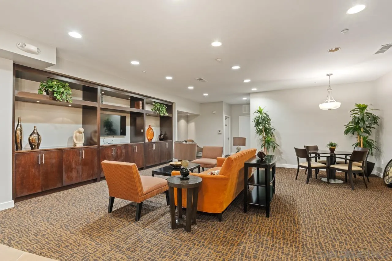 3650 Fifth Avenue, Unit 614 San Diego, CA 92103 - Photo 56 of 62 a living room with furniture a window and a table