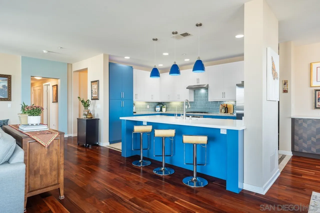 3650 Fifth Avenue, Unit 614 San Diego, CA 92103 - Photo 10 of 62 a large kitchen with granite countertop a large counter top space and stainless steel appliances