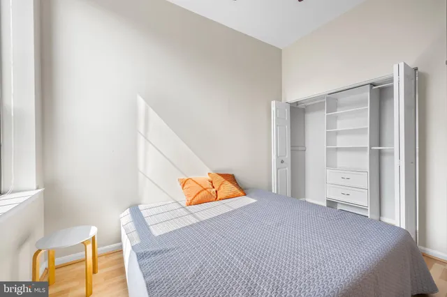 a bedroom with a bed and a couch