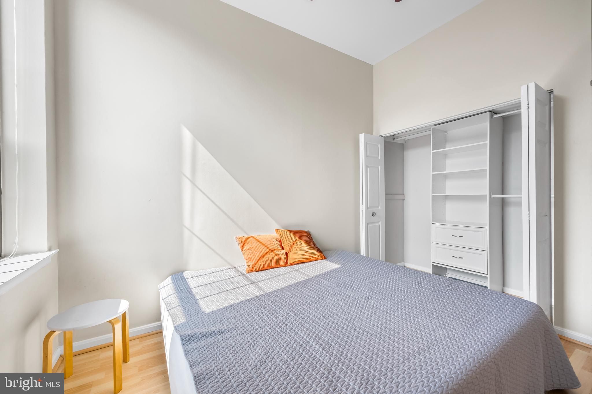 1011 Hunter Street, Unit F4 Baltimore, MD 21202 - Photo 14 of 19 a bedroom with a bed and a couch