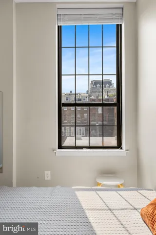a view of a room with a large window