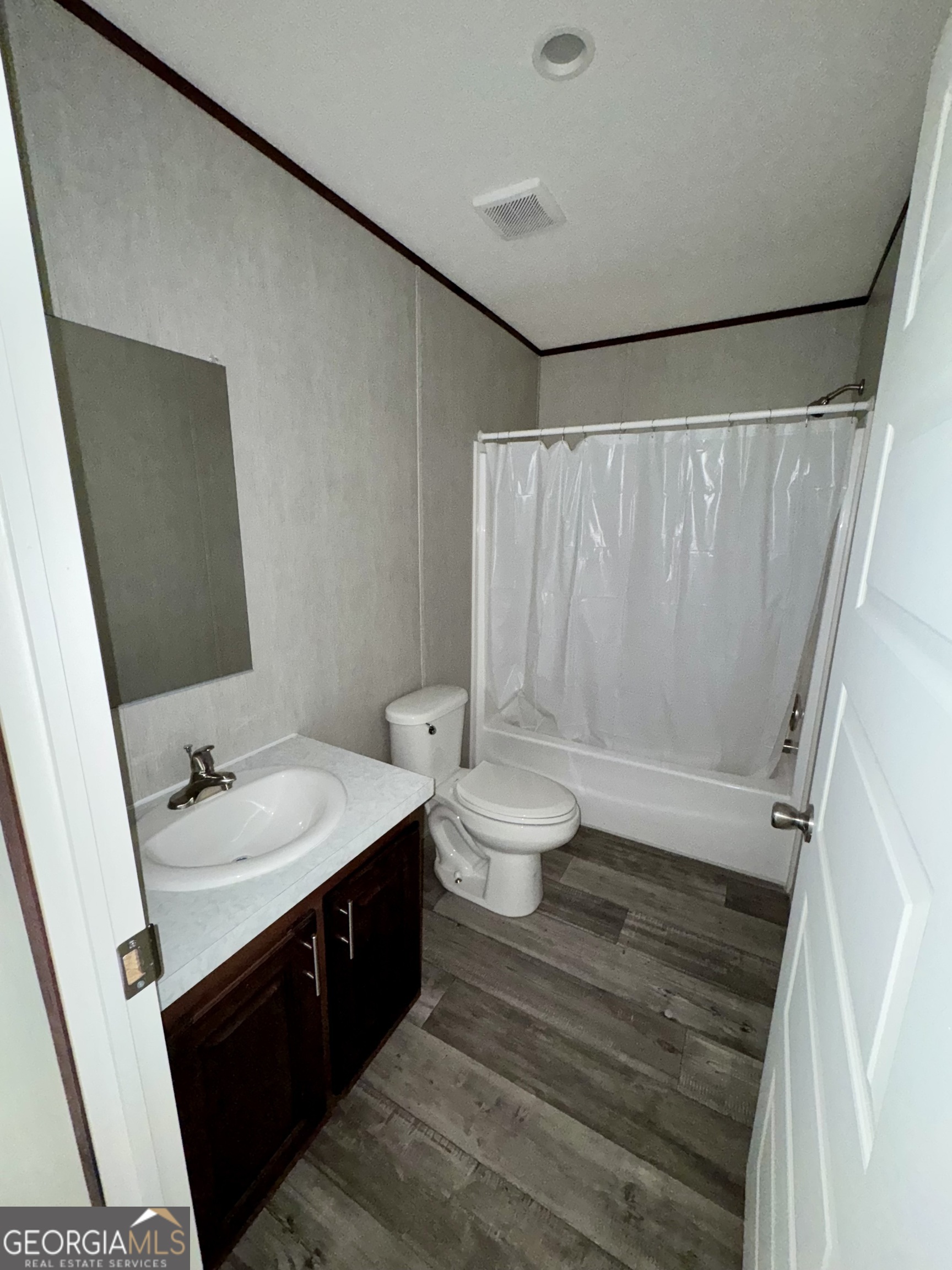 420 Mosley Bridge Road Claxton, GA 30417 - Photo 14 of 23 a bathroom with a double vanity sink toilet and shower