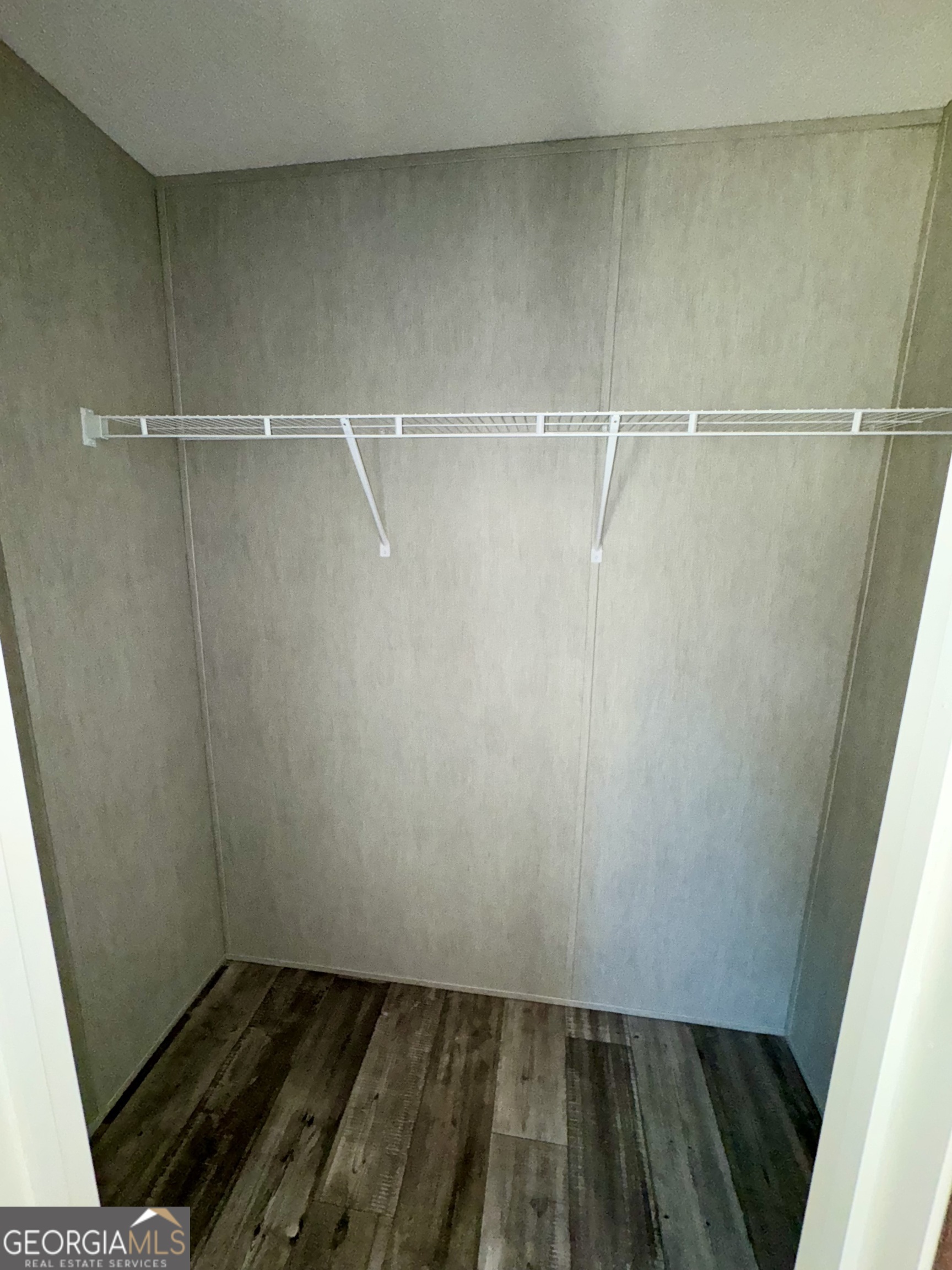 420 Mosley Bridge Road Claxton, GA 30417 - Photo 15 of 23 a view of a room with wooden floor