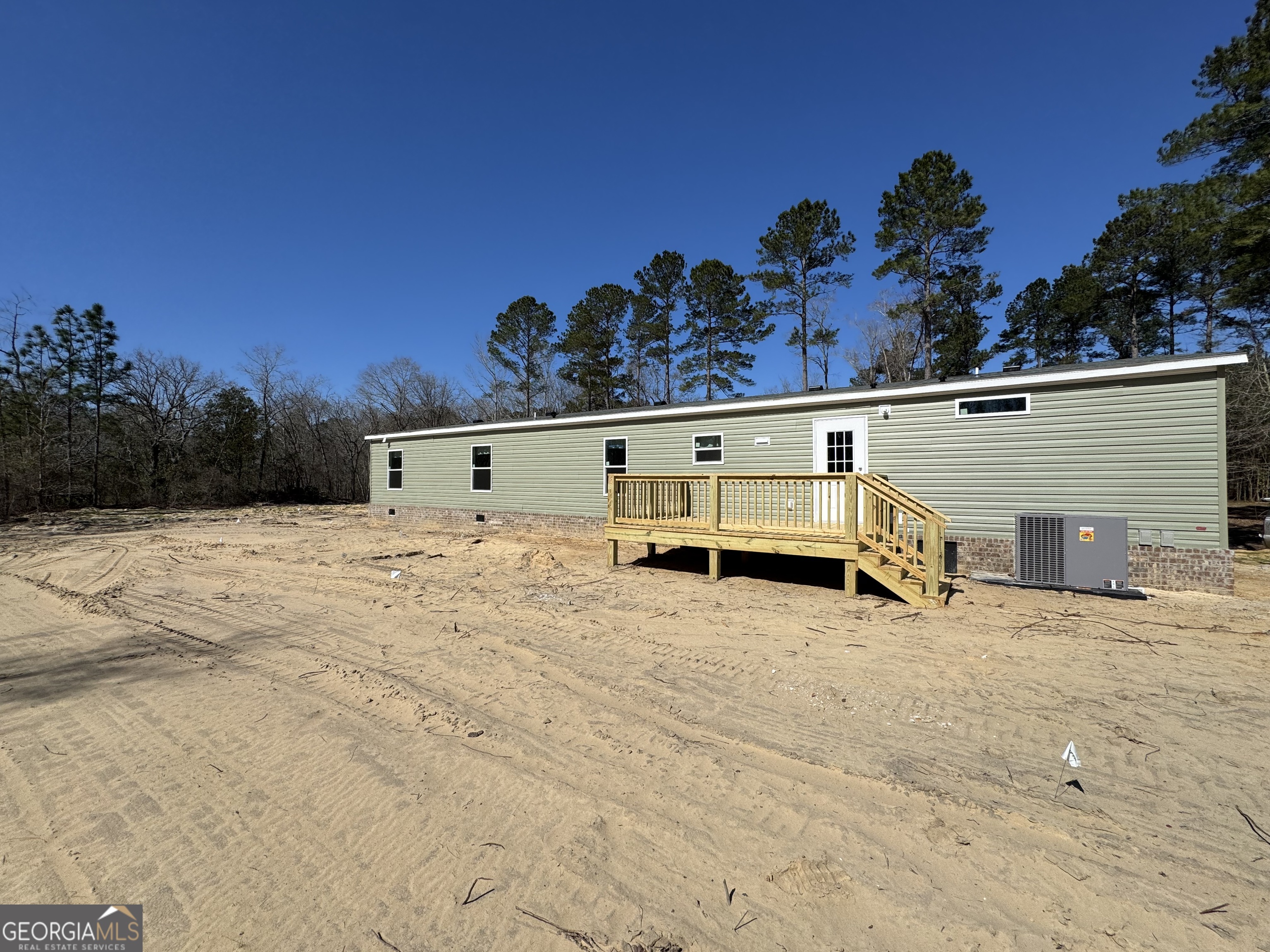 420 Mosley Bridge Road Claxton, GA 30417 - Photo 3 of 23 a view of a house with a snow in the yard