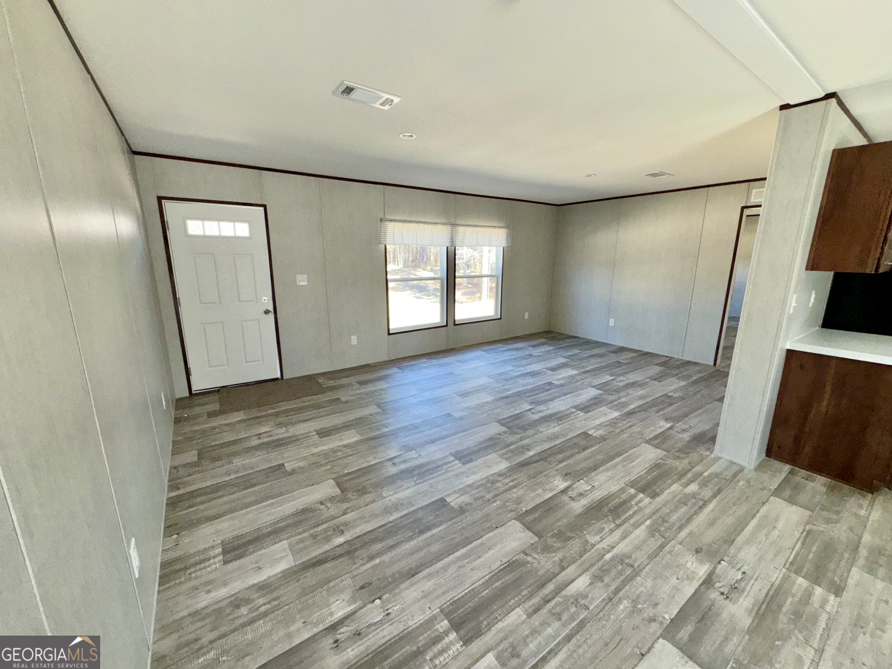 420 Mosley Bridge Road Claxton, GA 30417 - Photo 6 of 23 a view of empty room with wooden floor