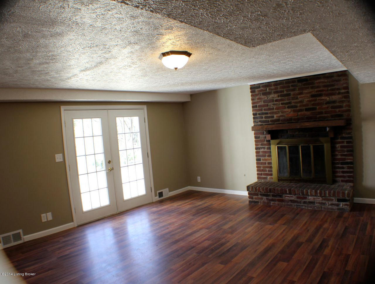 6615 Downs Branch Road Louisville, KY 40228 - Photo 19 of 37 Lower Level Family Room, with Cozy Fireplace, exits onto rear patio of home