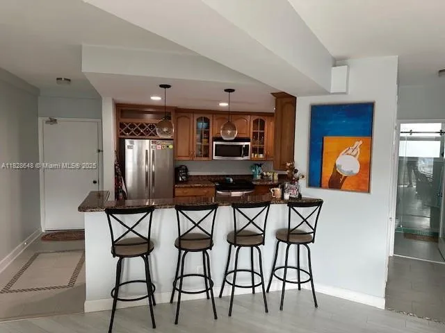 a balcony with table and chairs