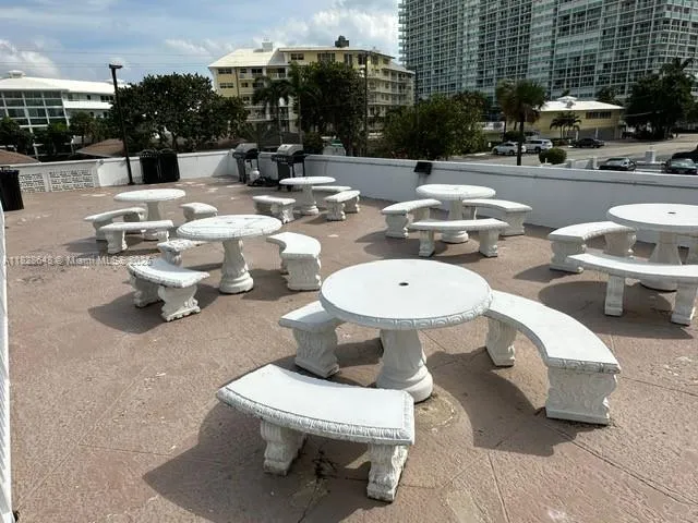 a view of a swimming pool with sitting area