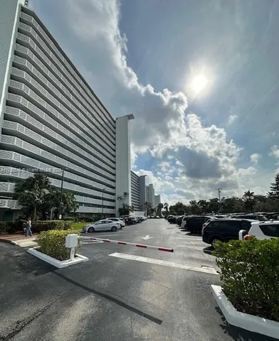 a view of a yard with wooden fence