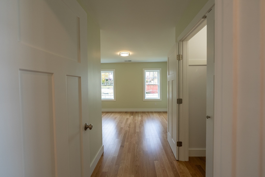 159 State Street New Bedford, MA 02740 - Photo 17 of 30 a view of hallway with wooden floor