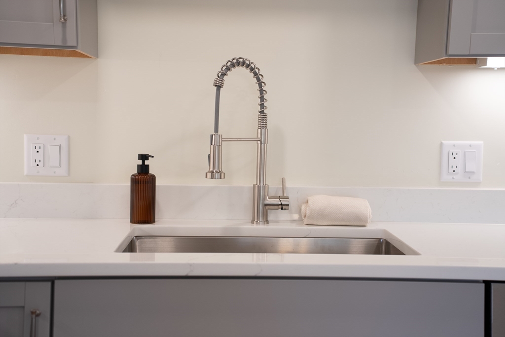 159 State Street New Bedford, MA 02740 - Photo 3 of 30 a bathroom with a sink and a mirror