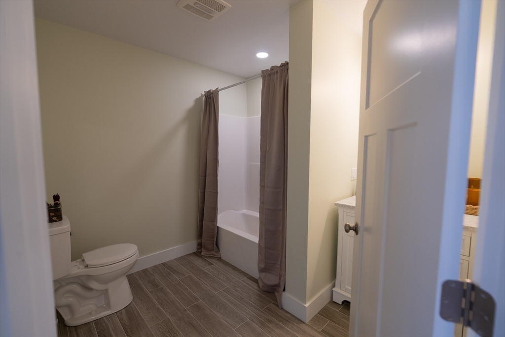 159 State Street New Bedford, MA 02740 - Photo 9 of 30 a bathroom with a sink and a mirror