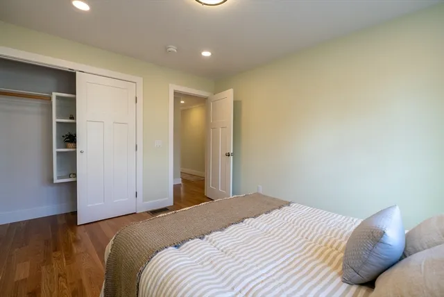 a bedroom with a bed and a cabinets