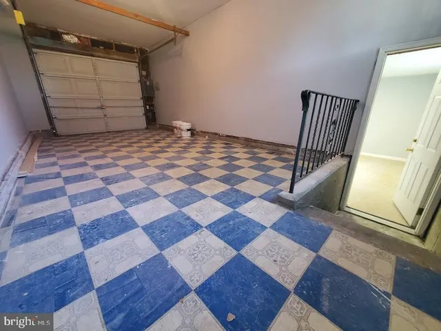 a view of a door of a house with wooden floor
