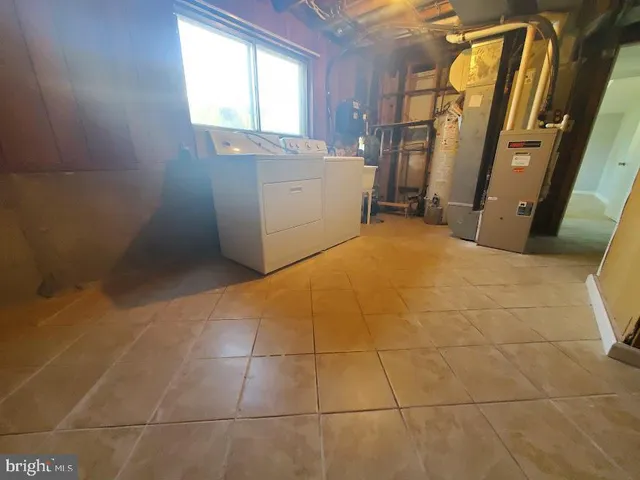 a bathroom with a sink toilet and mirror