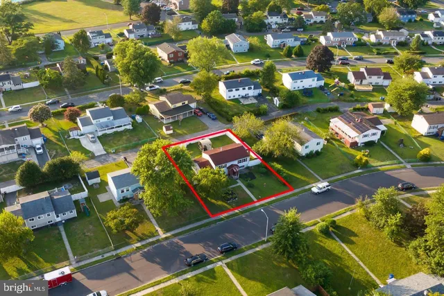 an aerial view of swimming pool patio and mountain view in back