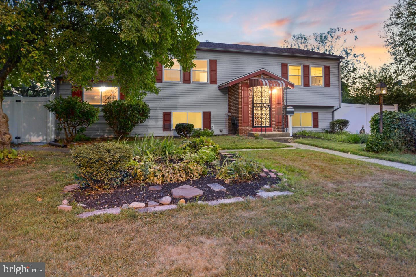 219 Harvard Avenue Pemberton, NJ 08068 - Photo 3 of 42 a front view of a house with a yard