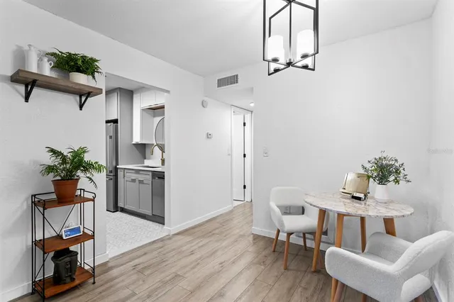 a bathroom with a sink toilet a mirror and shower curtain